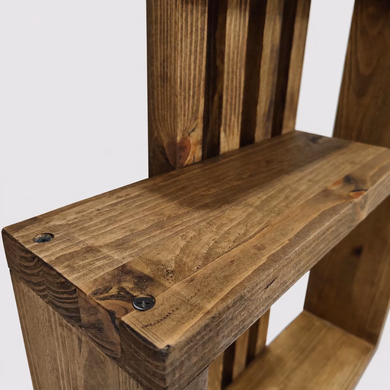Solid pine wall shelf joinery and visible handmade fixing detail