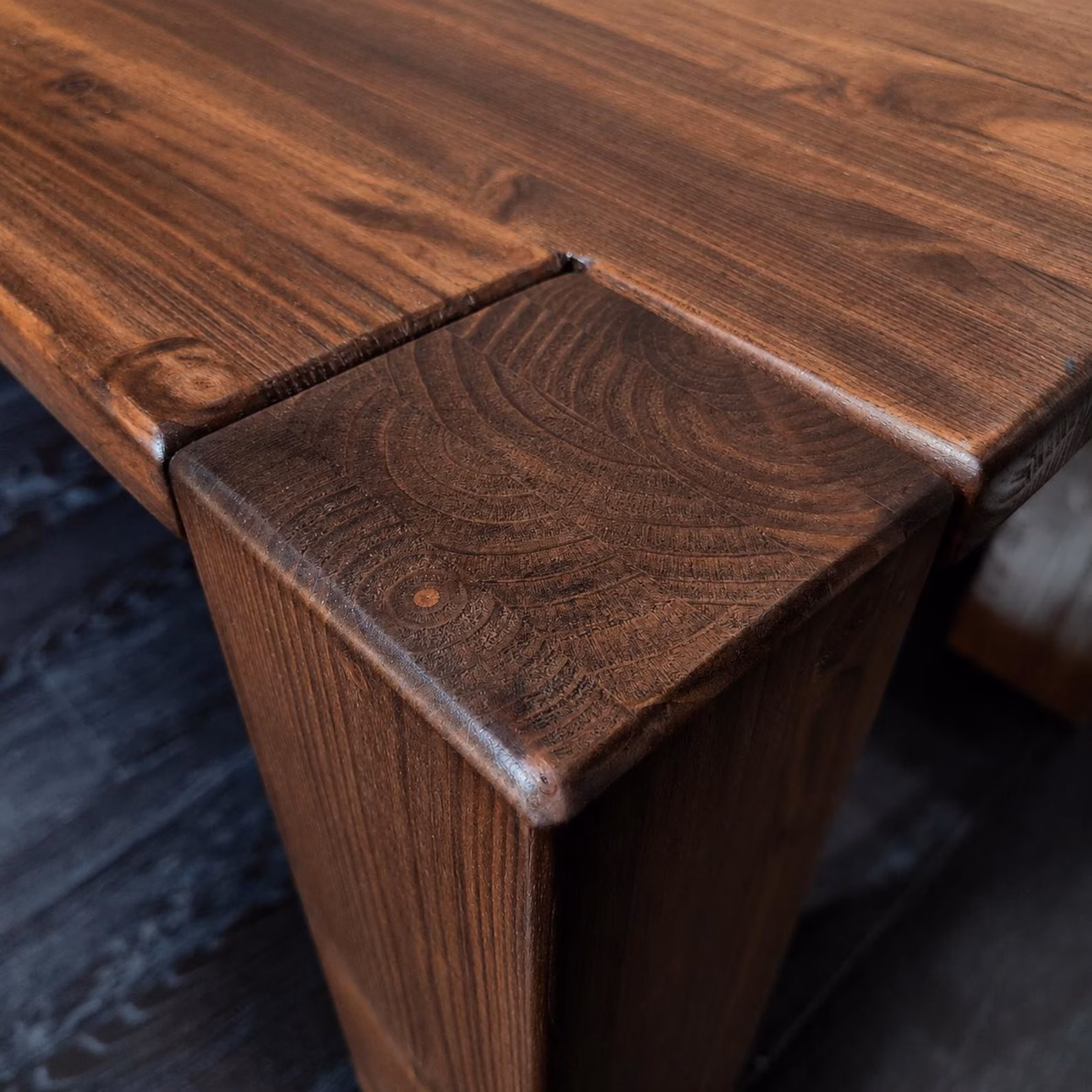 Solid walnut coffee table corner and chunky timber leg detail