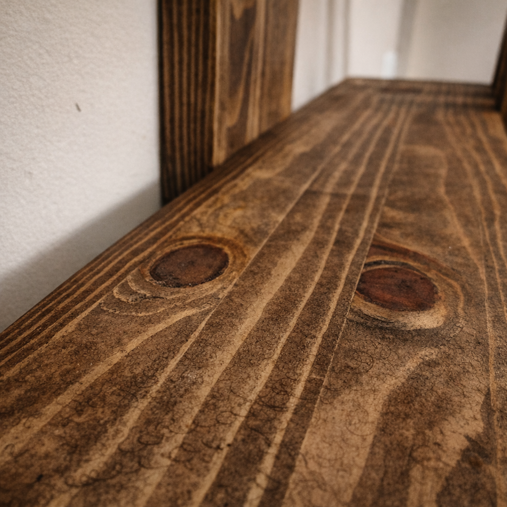 Detailed view of natural pine wood knots and rustic dark oak finish
