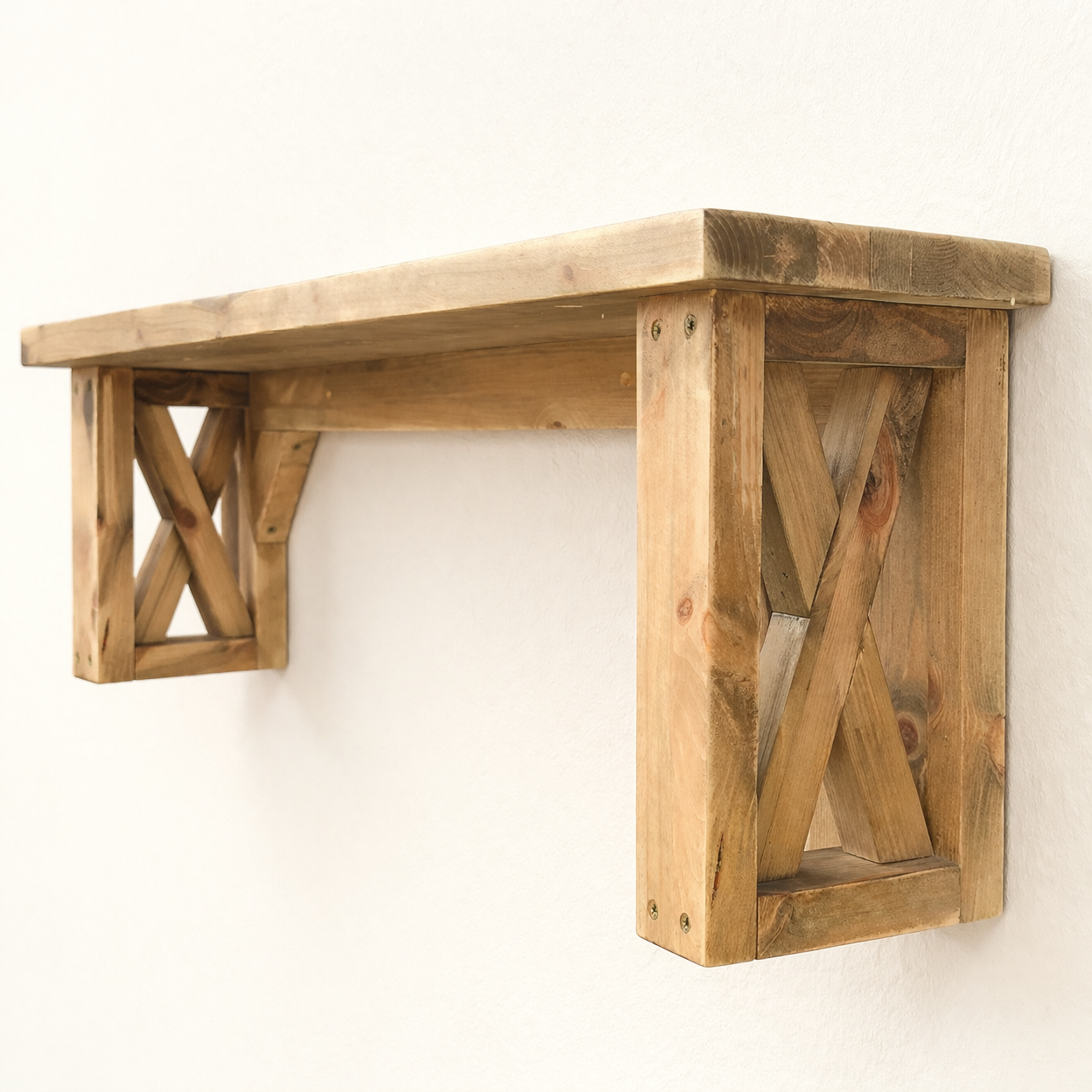 Side view of solid pine wall shelf with rustic X-shape support brackets