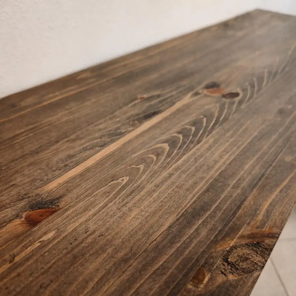Detailed view of handmade solid pine console table top with natural knots