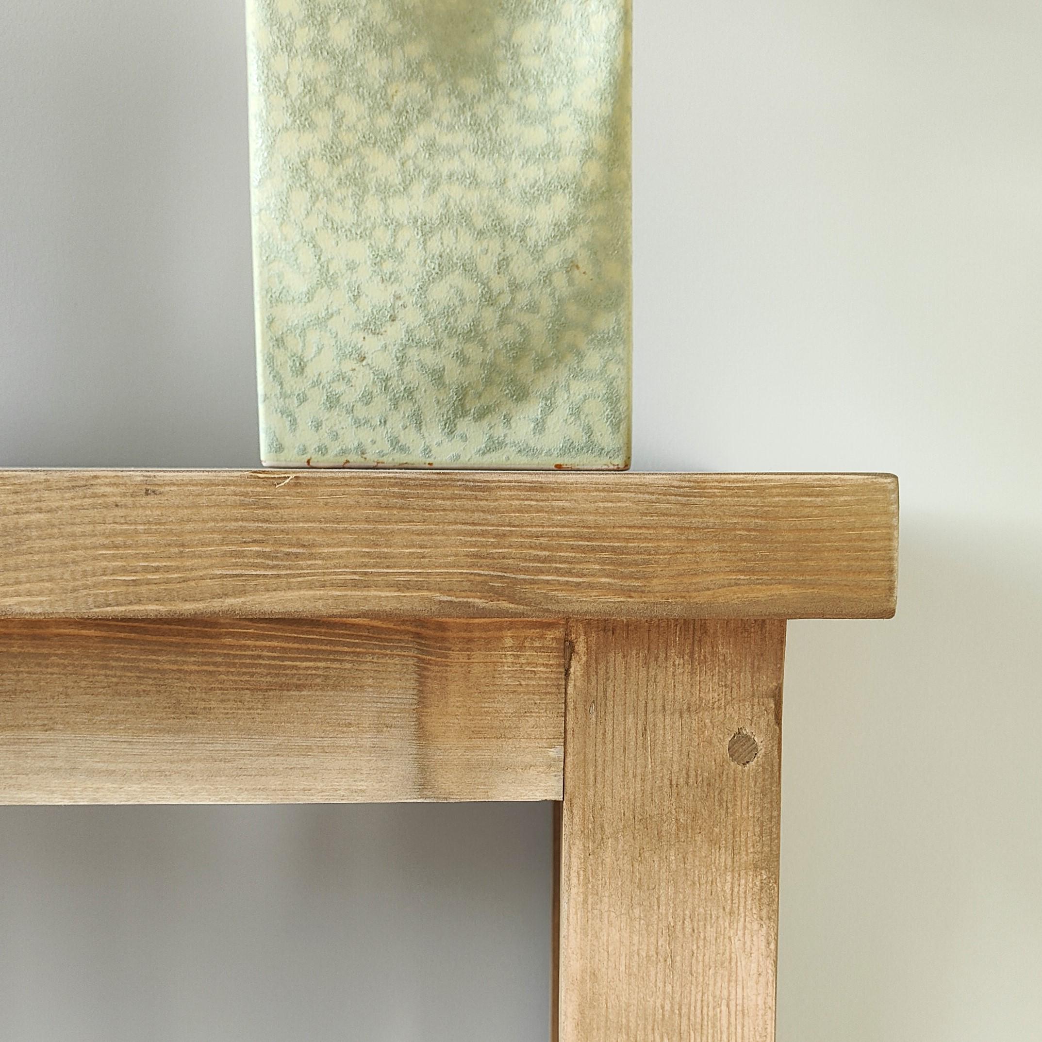 Close-up of solid pine console table corner and natural wood grain
